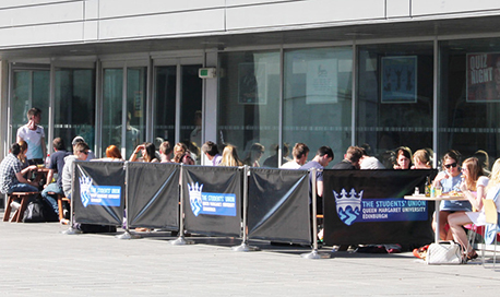The  Student Union outdoor seating area full of students