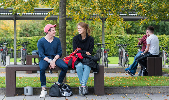 Students talking on the benches outside , Edinburgh